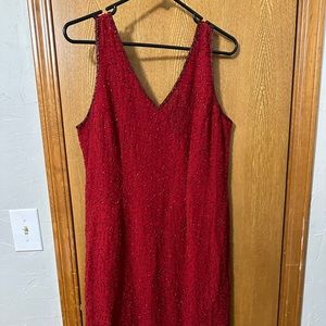 Red tea length beaded dress.